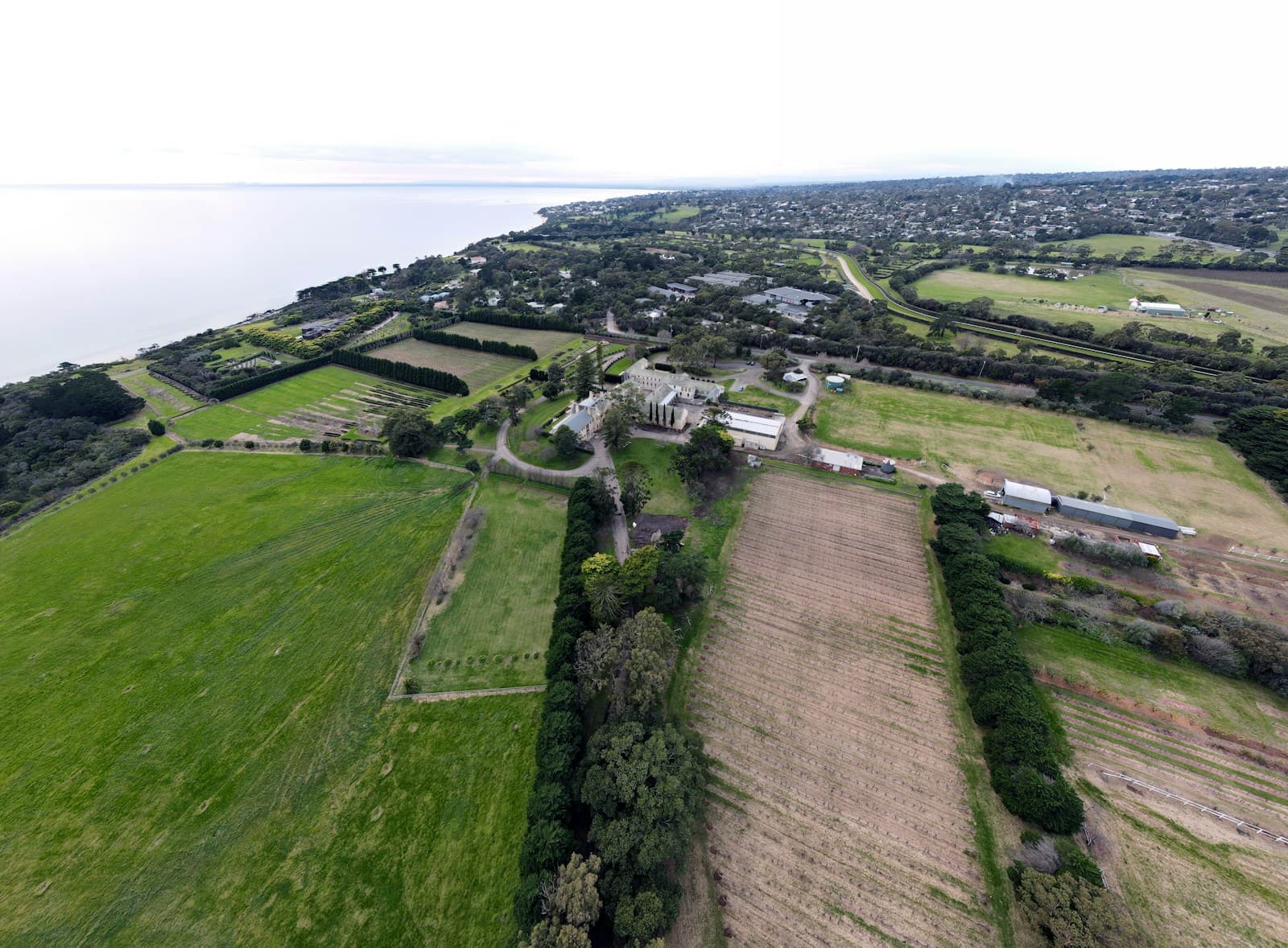 Aerial view across Mornington Peninsula farmland and bay